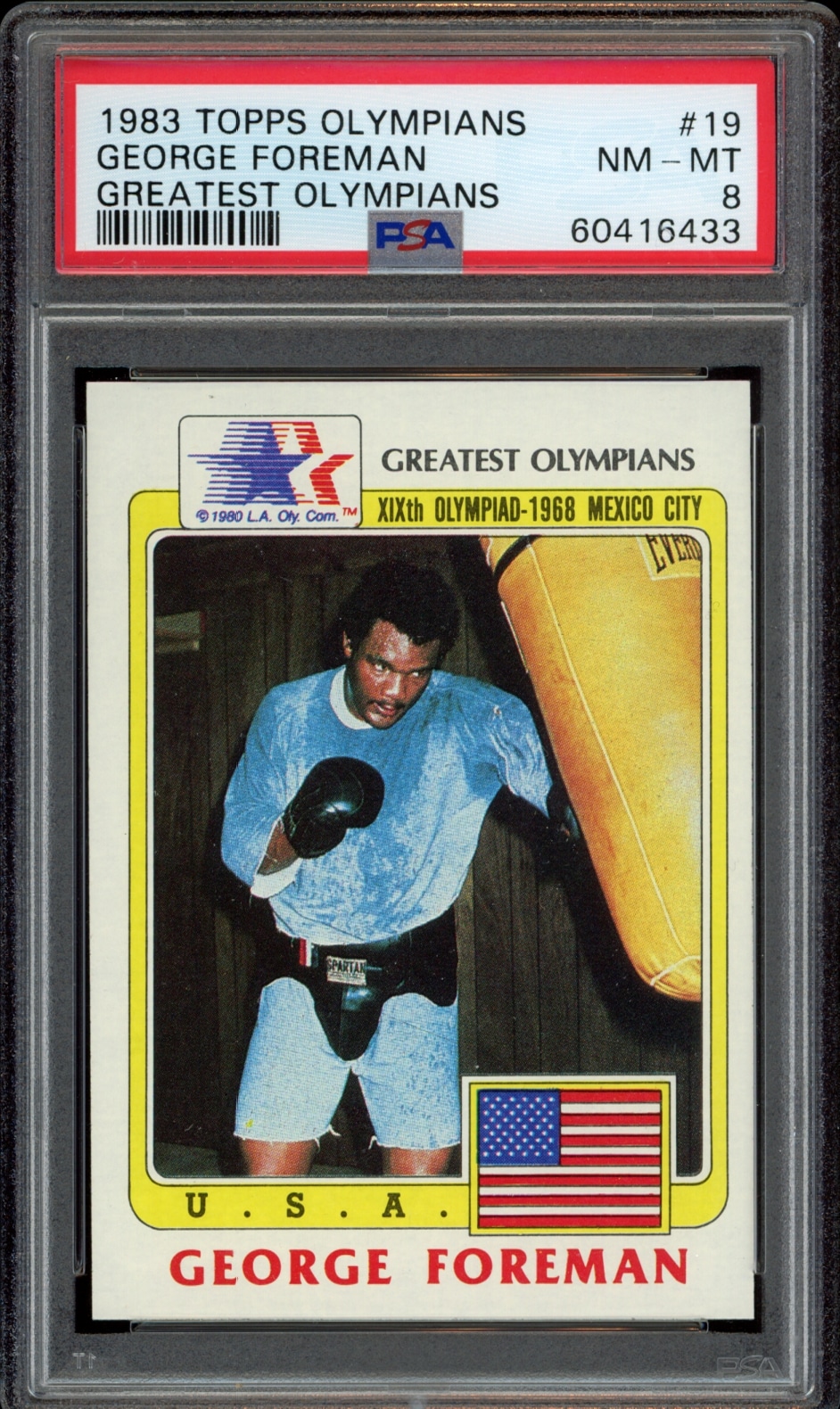 George Foreman 1983 Topps Olympians card, graded PSA 8, showcasing Olympic boxing excellence.