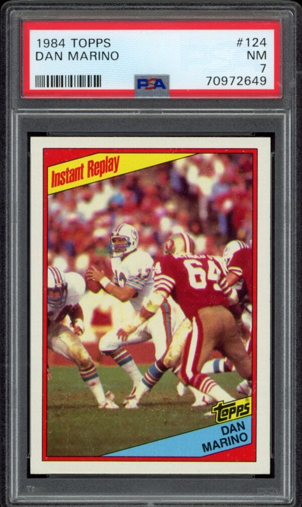 1984 Topps Dan Marino football card, graded MINT by PSA, featuring action shot on field.