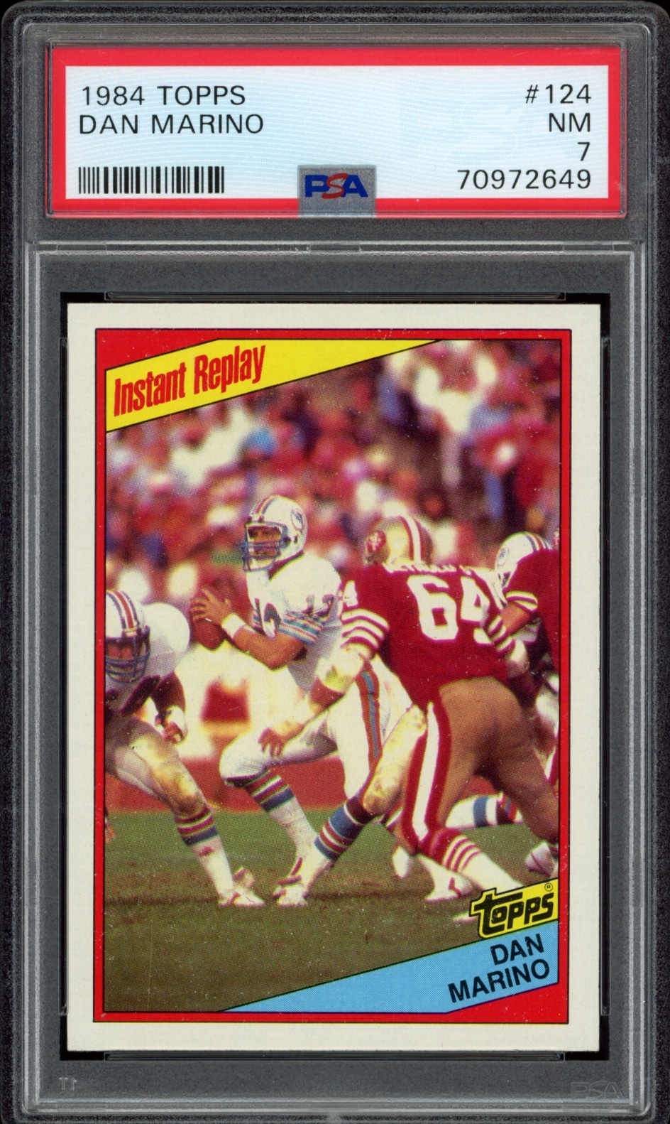 1984 Topps Dan Marino football card, graded MINT by PSA, featuring action shot on field.
