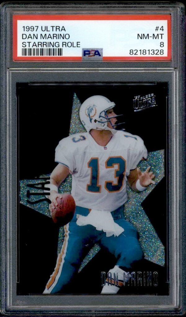 1997 Ultra Dan Marino trading card, PSA 8, featuring dynamic action pose and star motif.